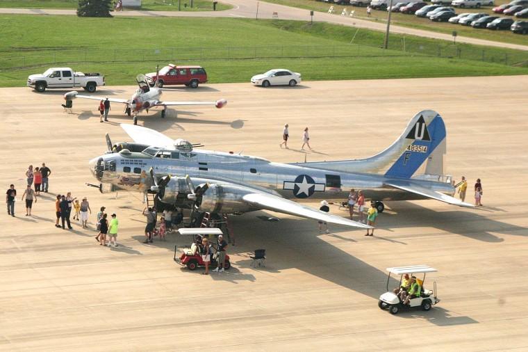 Visitors at the DeKalb Cornfest inspect a B-17 aircraft brought to the fest by the Arizona branch of the Commemorative Air Force Saturday Aug. 21 at the DeKalb Municipal Airport.