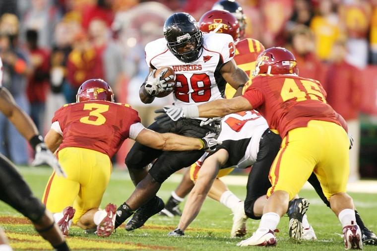 NIU running back Chad Spann is swarmed by Iowa State defenders during the Huskies 27-10 loss Thursday night.