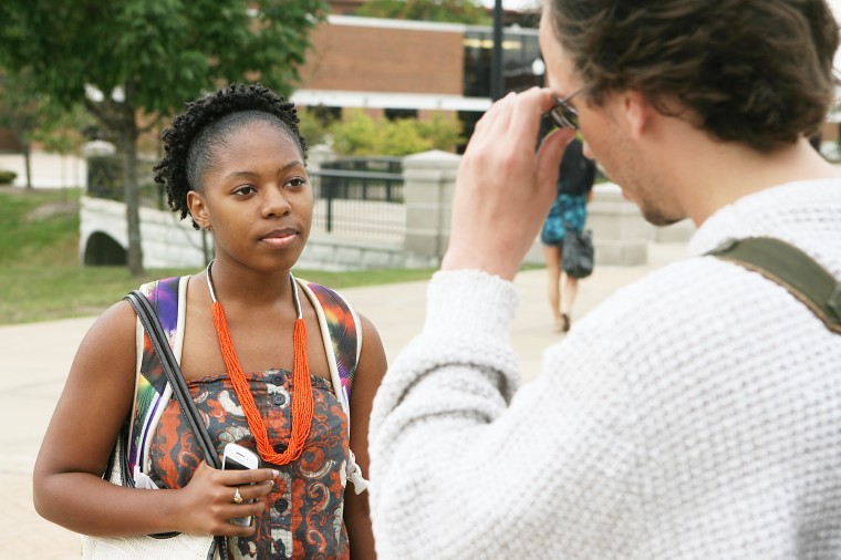 Daysha Blackwell, ophomore psychology and sociology major and member of NIU Campus Crusade for Christ and Jesus is the Way Christian Center, speaks with Thomas Hodges about religious views Thursday afternoon near Neptune Central.