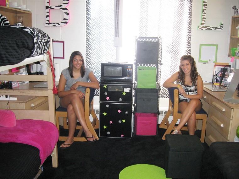 Freshman pre-optometry major Lindsay Johnson (right) and freshman pre-nursing major Brianna Frenzel have blended styles to decorate their room in Neptune Hall. 