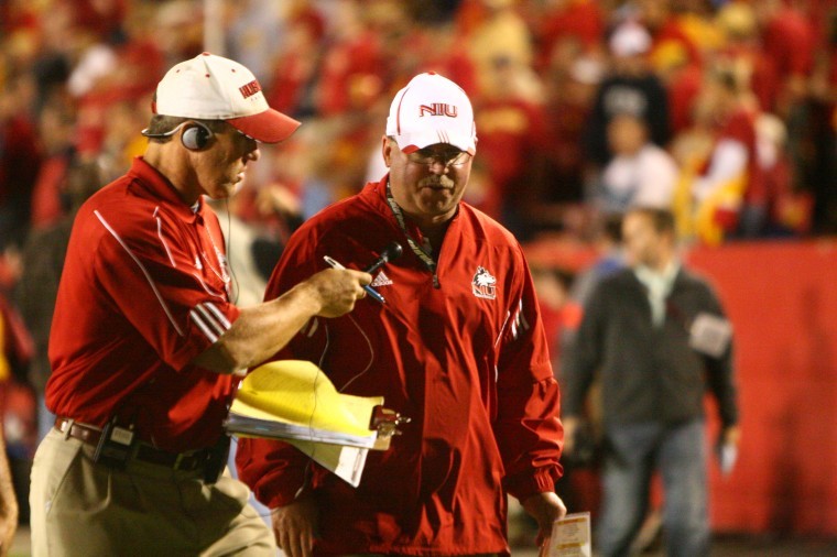 NIU football head coach Jerry Kill talks to another coach during the season opener against Iowa State Sept. 2. 