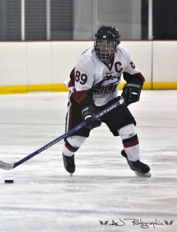 NIU captain Mike Reporto skates during the Huskies season opener.