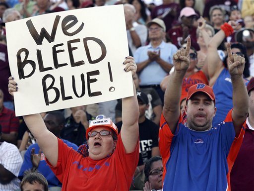 Boise State fans Gretchen and Dan Simpson, from Tucson, Ariz., cheer during an NCAA college football game against New Mexico State, Saturday, Oct. 2, 2010, in Las Cruces, N.M. (AP Photo/Victor Calzada)