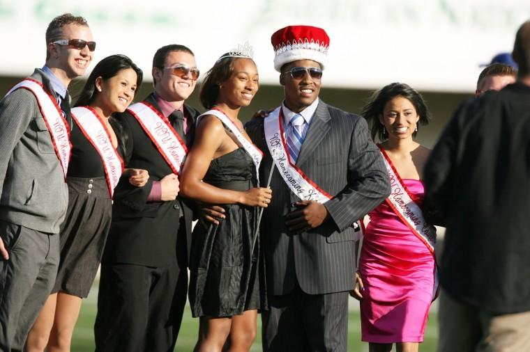 Homecoming King Elliot Echols, junior sociology major, and Homecoming Queen Sunsea Shaw, senior sociology major, poise with other members of Homecoming Court after being crowned during halftime of the football game Saturday.