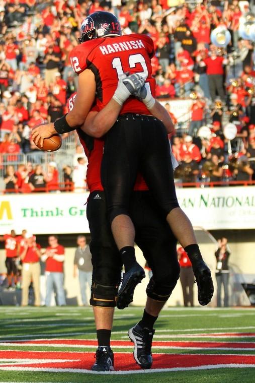 Harnish and another NIU teammate celebrates a touchdown in a game earlier this season.
