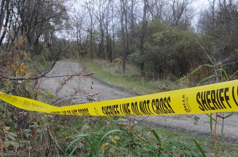 Police tape marks off the path through Prairie Park in DeKalb during the Toni Keller investigation. The DeKalb Park District will be increasing patrols and will add additional informational signs to ease public safety concerns in the area. 
