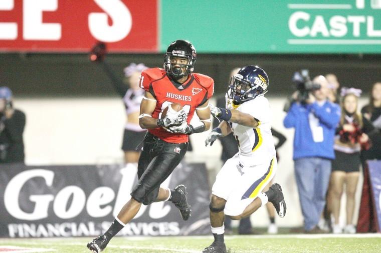 NIU wideout Nathan Palmer hauls a touchdown reception against Toledo on Tuesday night. 