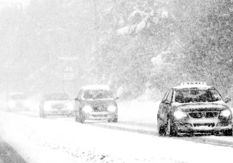 A general view of motorists driving through the heavy snowfall, in Stanley, England, Saturday, Nov. 27, 2010. 