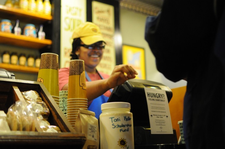 Adrianne Bassett, junior early childhood education major, checks out a customer at Potbelly, 1013 W. Lincoln Highway, on Wednesday night. The NIU Forensics team hosted a fundraiser at Potbelly for the Toni Keller Scholarship funds, with 25 percent of the profit going toward the scholarship. 