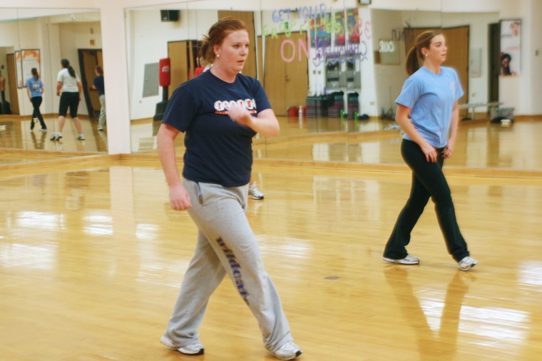 Lexy Rux, sophomore communications major, and Jordan Boyer, MBA graduate student, participate in the Hip Hop Hustle class at the Recreation Center on Nov. 8, 2011. The rec offers a variety of classes throughout the week which are free for students to participate in.  