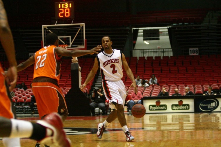 NIU guard Demarcus Grady dribbles down the court in a game against the Ohio Bobcats.