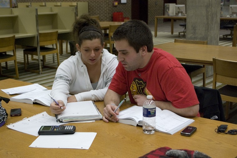 Sophomore business administration majors Michelle DiVita (left) and Nick Nudo (right) study at Founders Memorial Library Wednesday night. 