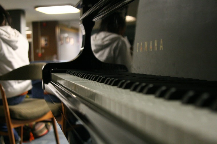The piano on the main floor of the Holmes Student Center occasionally serves as a distraction for students studying, as well as the hotel workers. 