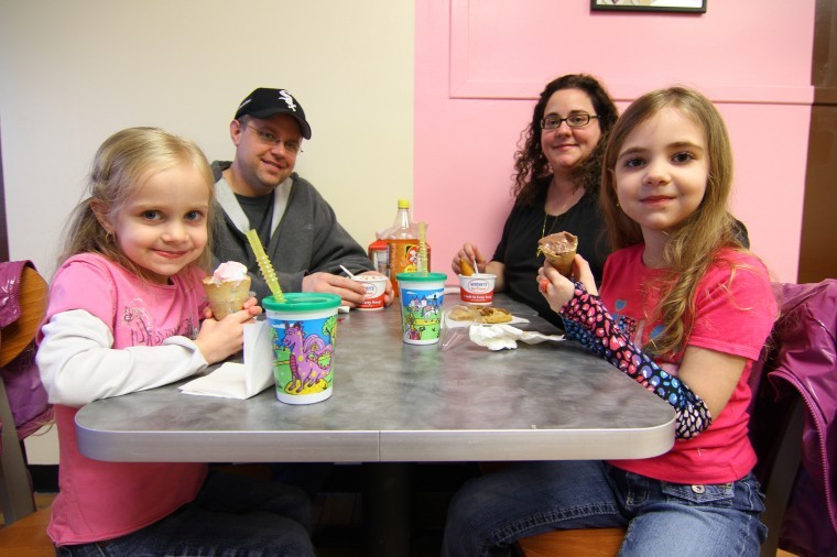 The Samonds family eat ice cream at the new Sunshine Scoop Shoppe & Bakery April 19, 2011. The shop is located in the Junction Shopping Center.