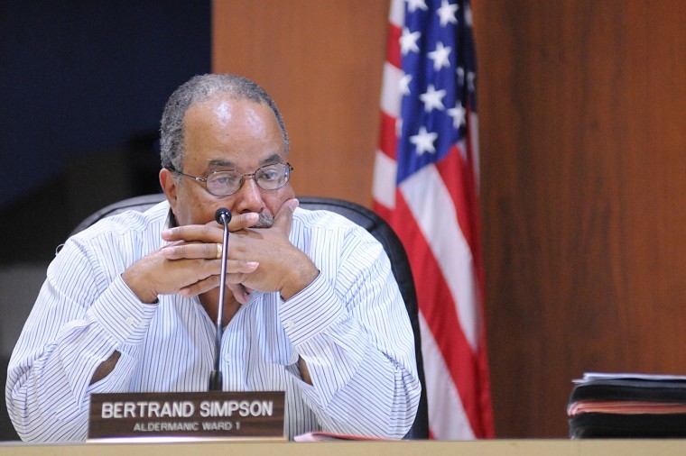 First ward alderman Bertrand Simpson listens to debate about outsourcing the city attorney and assistant city attorney's position Monday night at the regular meeting of the DeKalb City Council. 