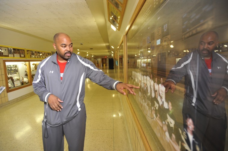 John T. Greilick | The Detroit News
Saginaw High School athletic director and boys varsity basketball coach Lou Dawkins points out players on his 2008 state championship team, including Draymond Green, who now stars for the Final Four-bound MSU Spartans. 