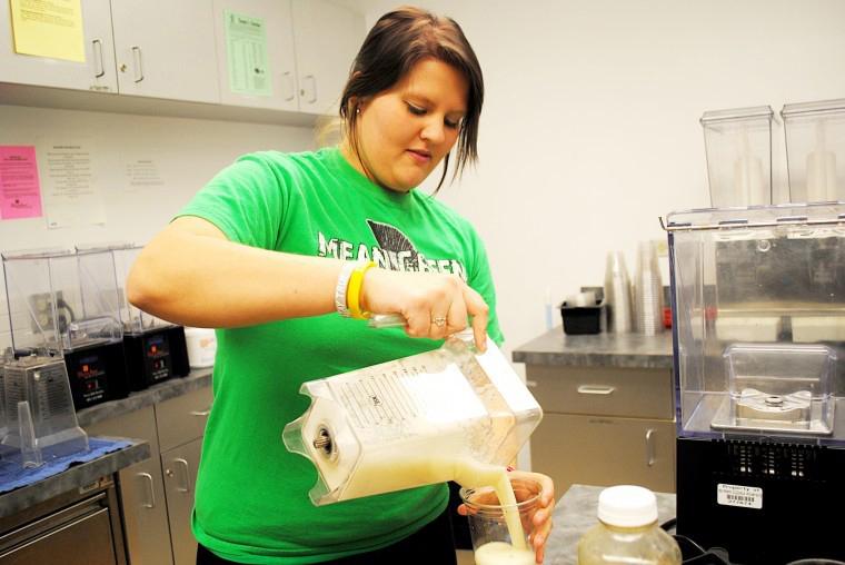In this file photo freshman psychology major Rachel Menor makes a smoothie at the smoothie counter inside the Campus Recreation Center.