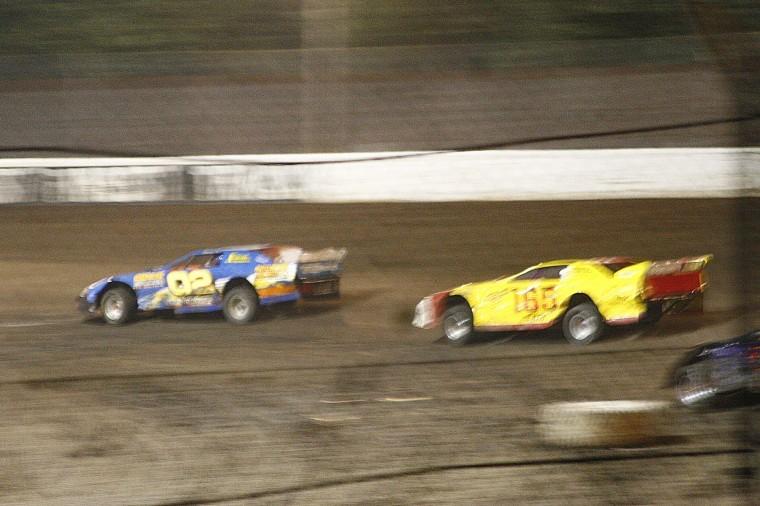 Jim Klingel of Aurora races in the number 02 car against Johnny Heath of Kingston in the 165 car Aug. 21 at the Sycamore Speedway.