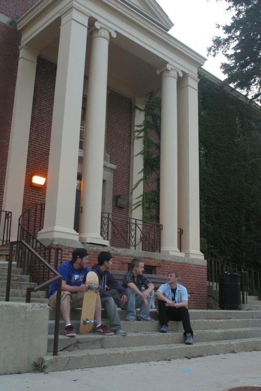 Christian Smith (left), Johnny Tran (left center) junior time
arts majors, Alex Beach (right center), and Mike Lundgren (right)
senior new media technology majors talk on the stairs of Gilbert
Hall Tuesday evening.
