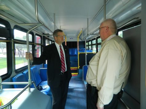 Congressman Randy Hultgren speaks with Al Davis, General Manager
of Huskie Bus regarding the Huskie Bus system.
