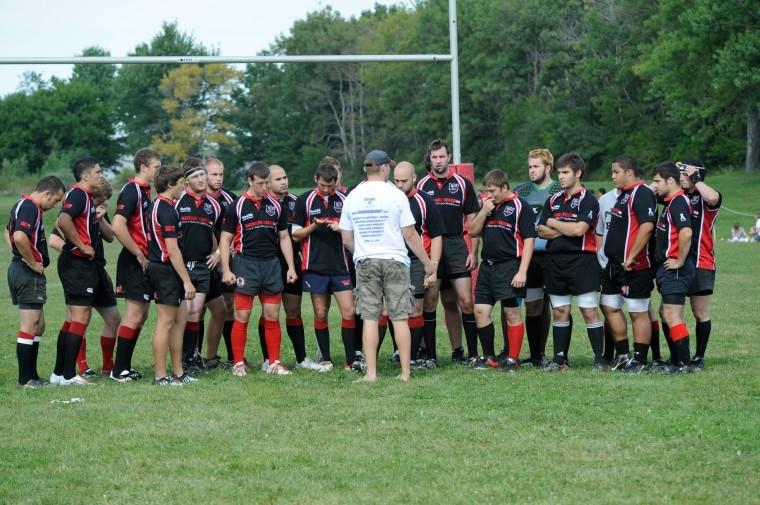 Northern Star File Photo The NIU Rugby team meets to discuss
post game.
