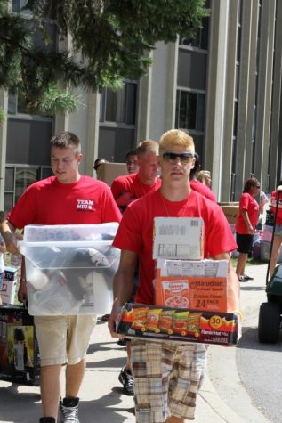 Jerry Burnes | Northern Star Junior marketing major Josh Bricker
helps move students in at Lincoln Hall Thursday afternoon.