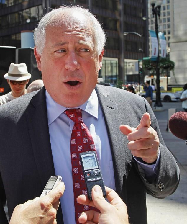 The Associated Press: Pat Quinn talks with reporters outside the
James R. Thompson Center in Chicago.
