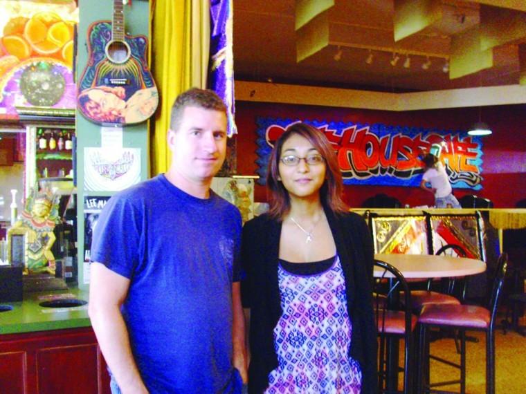 Daniel Sherrill, writer, director and talent recruiter for
Wooden Box Theater, stands with Vanessa Chavez, the host of
tonights Pink Floyd Night at the House Cafe, 263, E. Lincoln
Highway.
