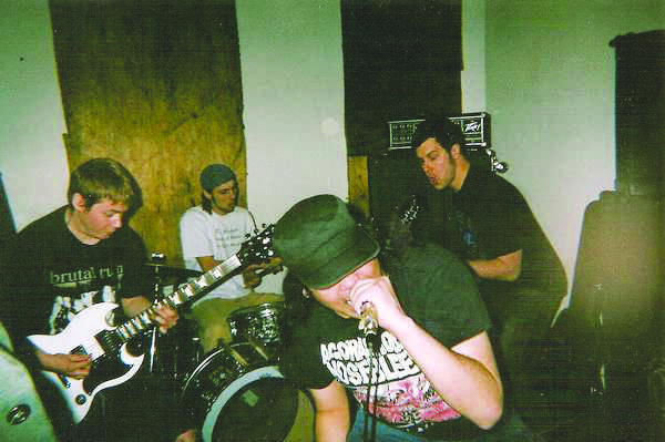 (From left): Ben Gonzo Gonzalez (guitar), Adam Tomlinson
(drums), Robert Belo Rebelo (vocals) and Kirk Syrek (bass)
perform as grindcore band Sick/Tired. Rebelo recently left the
group to persue other musical interests: a harsh noise project and
a heavy metal band. Adam Jenning of Winters in Osaka, Diatribes,
Paucities and Urine Cup has replaced the singer.
