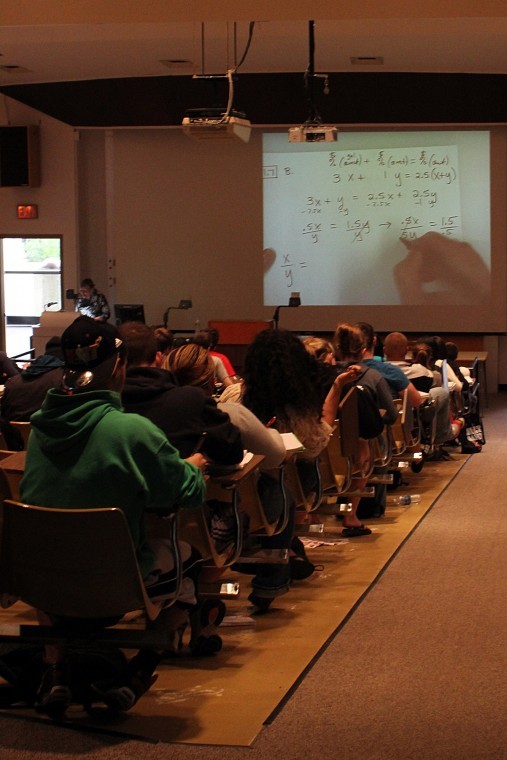Gavin Weaver | Northern Star Betty Corns Math 110 students take
notes in Montgomery Auditorium Wednesday afternoon.
