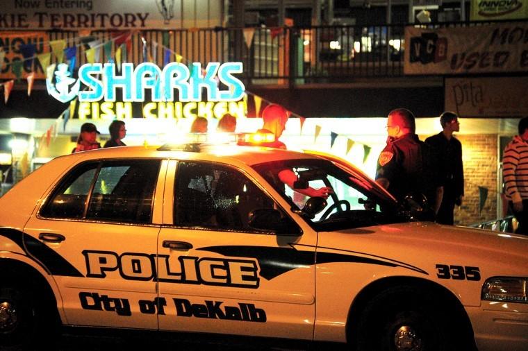 A DeKalb squad car sits outside Sharks, 901 Lucinda Avenue.
Police confirmed one person was shot in the leg and has been taken
to Kishwaukee Hospital with non-life-threatening injuries.
