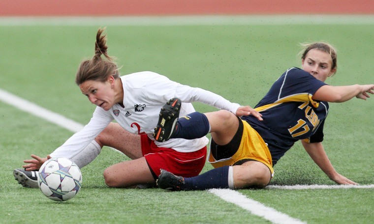 NIUs Becca Ford and Toledos Kristin Mattei fight for the loose
ball at the game on Friday.

