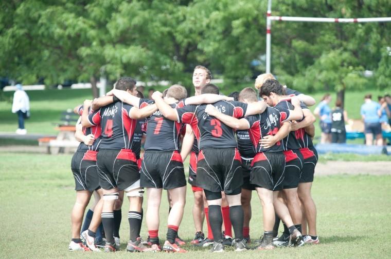 NIU mens rugby holds a team-huddle during its 76-5 victory over
Loyola this past weekend.
