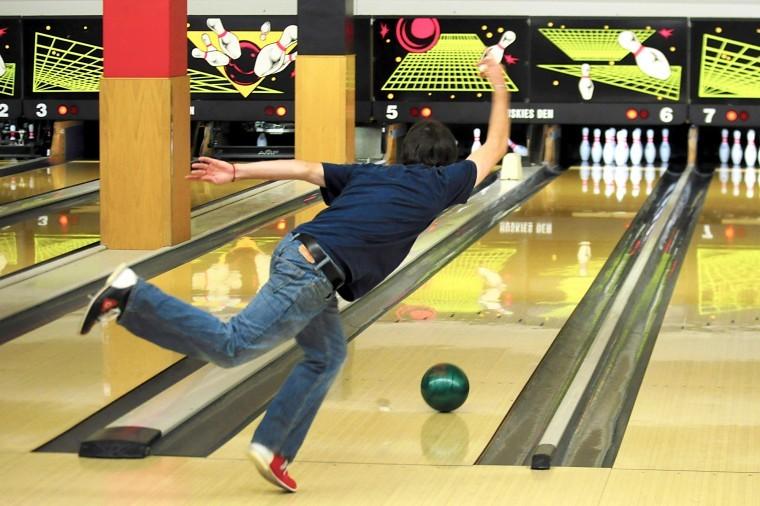 Brian Keefe, senior biology major, bowls during bowling class in
the Huskie Den at the Holmes Student Center Wednesday
afternoon.
