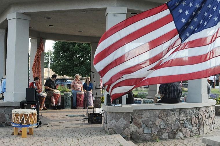 Patrons honor the victims of September 11 at DeKalb Square, 110
N. Fourth Street, by playing drums. The event was hosted by the
Unitarian Universalist Fellowship of DeKalb.
