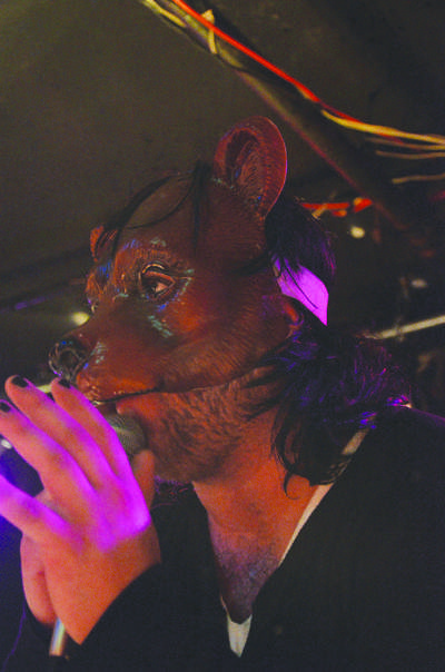 Vocalist Chris “the Bear” Hutka dons his bear mask.
