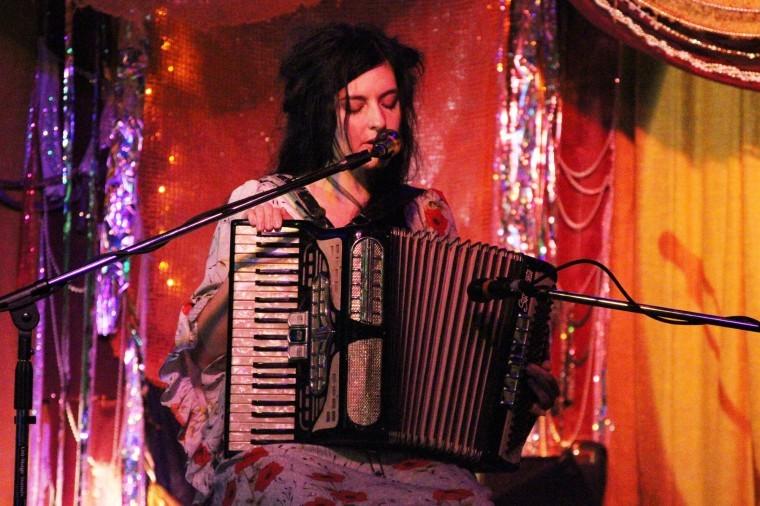 Eliza+Rickman+plays+an+original+piece+at+The+House+Cafe+Monday%0Anight.+Her+music+includes+a+wide+range+of+instuments+including+an%0Aaccordian%2C+a+toy+piano%2C+a+cowbell+tambourine%2C+and+a+looper+to+name%0Aa+few.%0A