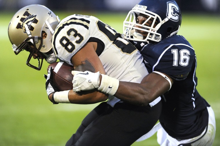 Western Michigans Jordan White (83) scores a touchdown under
pressure from Connecticuts Byron Jones (16) in the second half of
an NCAA college football game, in East Hartford, Conn., on
Saturday, Oct. 1, 2011. (AP Photo/Jessica Hill)
