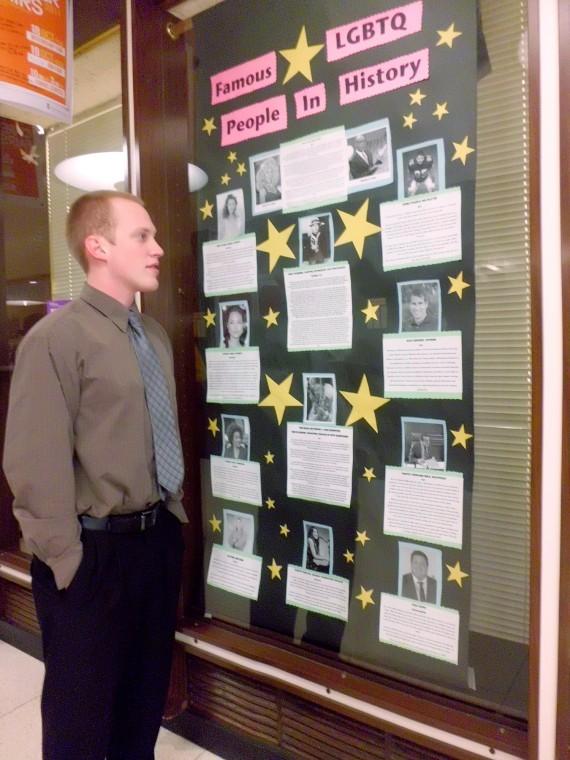 Northern Star Sophomore finace major T.J. Wolfe checks out the
LGBT history display in the Holmes Student Center on Tuesday
afternoon.
