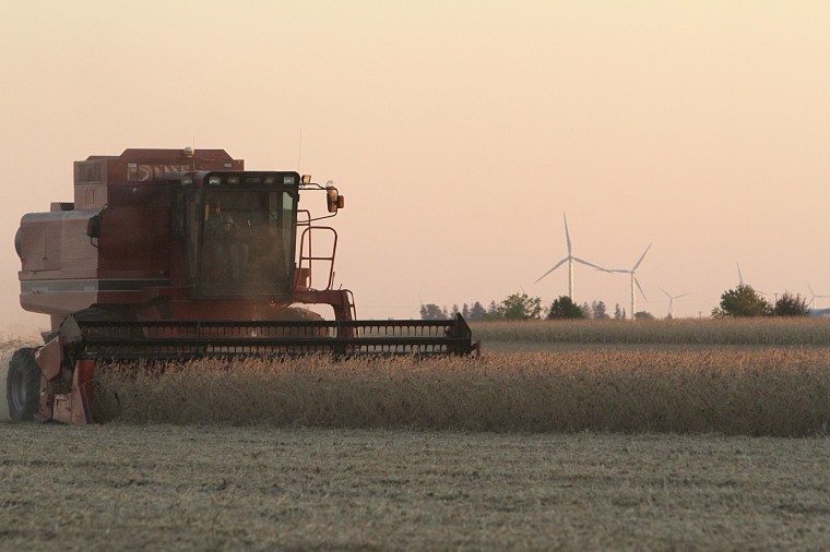 A farmer harvests his field on Lincoln Highway Wednesday night.
Farming equipment, such as combines, will begin to use DeKalb area
roadways, presenting a potential safety hazard to motorists.
