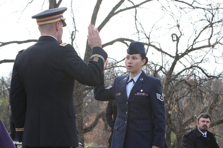 Jerry Burnes, Northern Star-Joann Garcia Hunter, Air Force Staff
Sergeant, takes part in a reenlistment ceremony Friday afternoon.
Hunters ceremony, typically done informally, closed out the NIU
Veterans Day event outside of Altgeld Hall.
