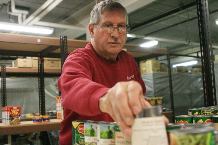 Gary Billings, 66, Dekalb, sorts donated food into bags at The
Salvation Army on 830 Grove Street in DeKalb Friday afternoon. They
will be hosting a Thanksgiving food drive next Tuesday at 9
a.m.
