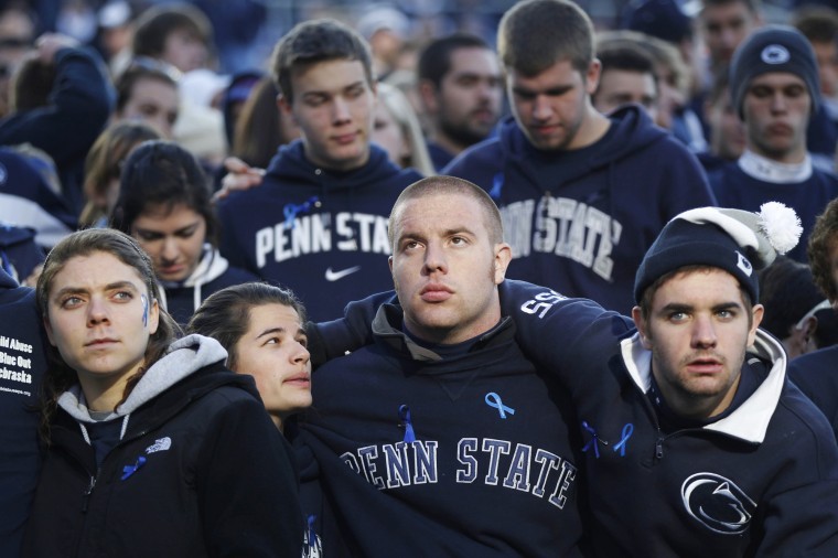 In this Nov. 12 file photo, fans in the student section react
after Nebraska defeated Penn State 17-14 in an NCAA college
football game in State College, Pa. Penn State was playing for the
first time in decades without former head coach Joe Paterno, after
he was fired in the wake of a child sex abuse scandal involving a
former assistant coach. As Penn State leaves a harrowing week
behind and takes tentative steps toward a new normal, students and
alumni alike wonder what exactly that means.

