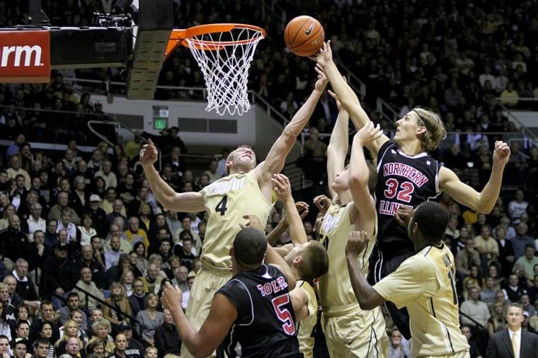 Aksel Bolin reaches to make a basket while Purdue’s defense tries to tip the ball out of his hand in a 2011 game. As of July 8, Bolin had 12 points in two games for Norway in the World University Games and will look to lead the Huskies during his senior season in 2013-14.