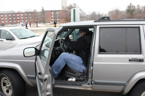 Pete Fraser, senior communications major and commuter student,
gets into his Jeep in the parking lot by DuSable to head home
Thursday afternoon.