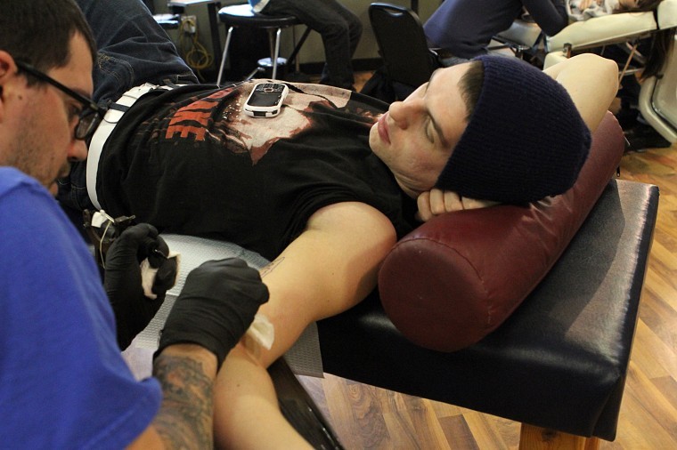 Drew Rogers, sophomore sociology major, gets a key tattoo at
Proton Tattoo, 120 S. 4th St.
