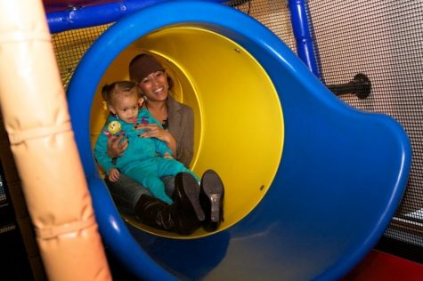 Senior journalism major Brittany Watson goes down a slide with
her daughter Haelo, 2, at a McDonalds playground in Sycamore on
Sunday.
