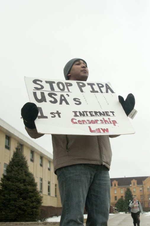 Jason Wilkins, second year law student, protests about PIPA in
the MLK Commons Monday afternoon.
