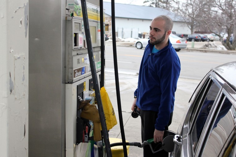 Jeff Achler, senior physical education major, pumps gas at the BP on Lincoln Highway Tuesday afternoon.
