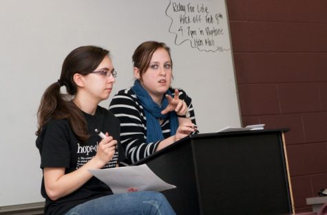 Northern Star Heather Olson (left), and Brittney Ginter, members
of Colleges Against Cancer, lead the club's meeting Tuesday
night.